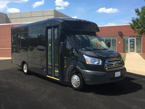 Ford Transit Battisti Limo To Go 12 Passenger black party bus exterior passenger entry side