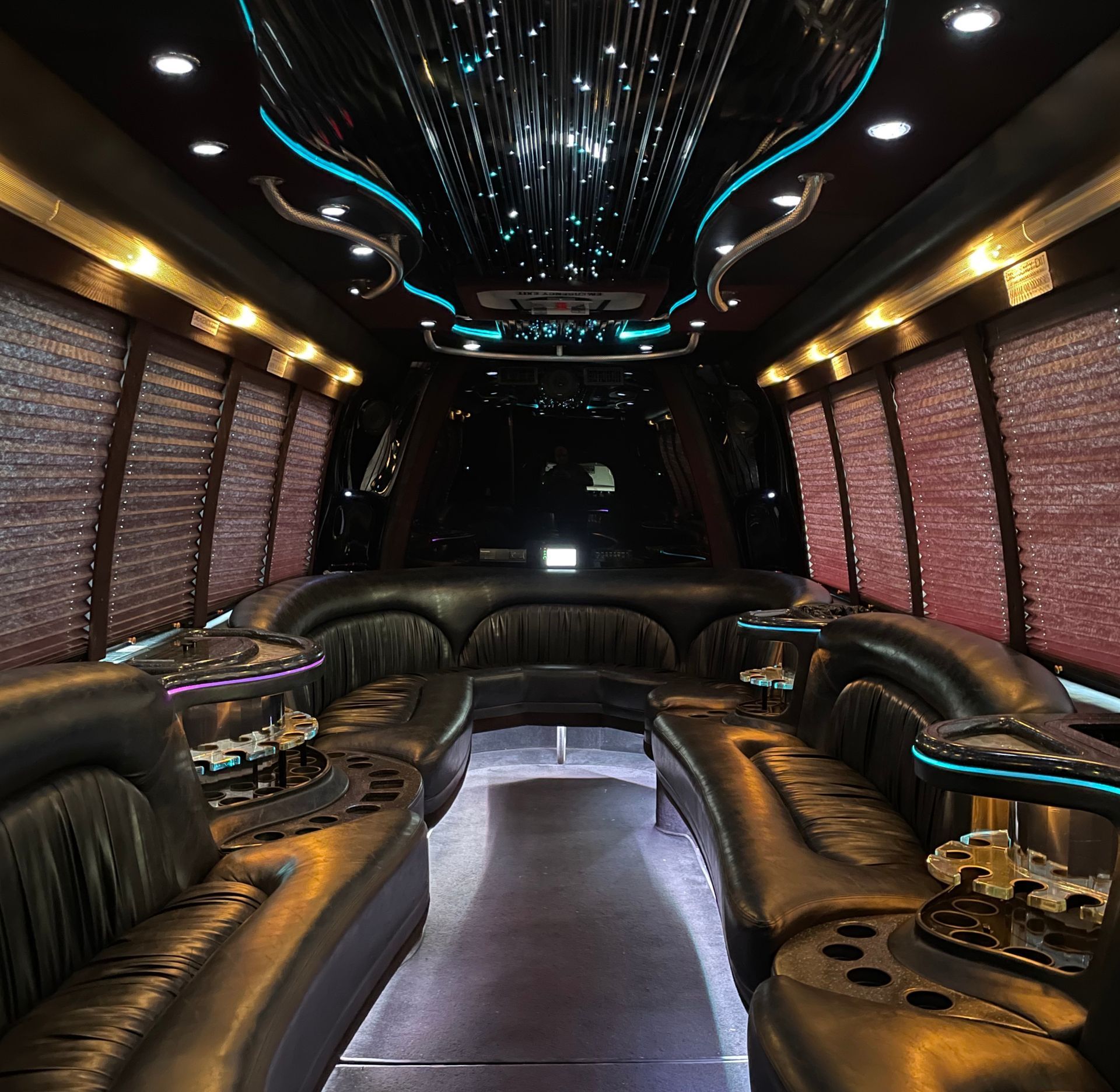 the inside of the Krystal Coach 24 passenger limousine with starry ceiling lights