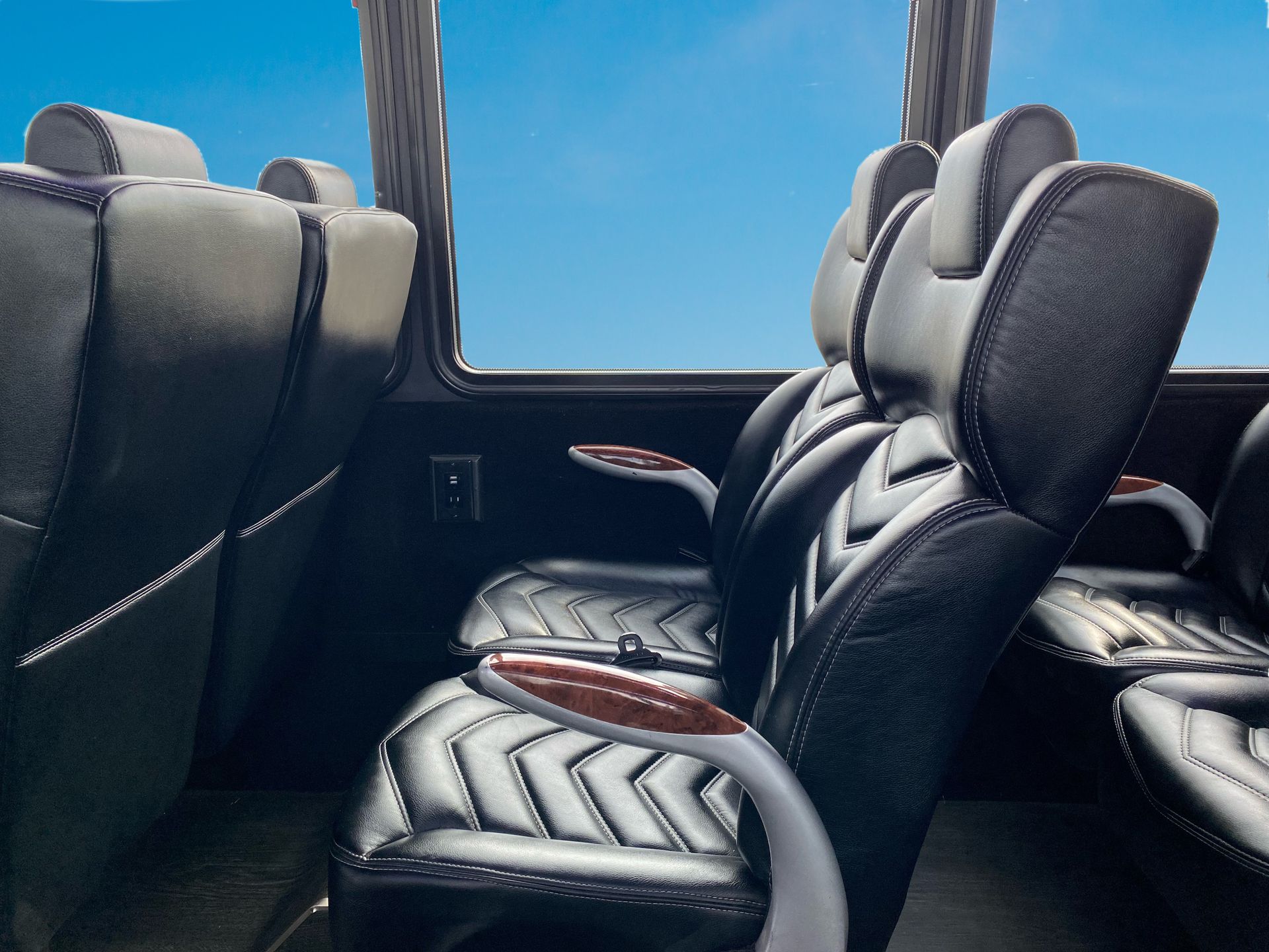 The inside of a bus with a blue sky in the background