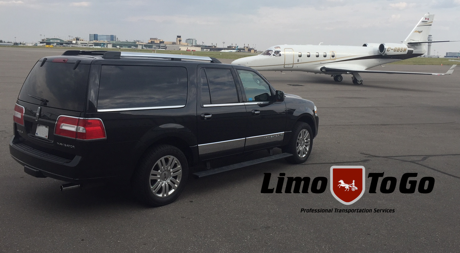 Black SUV parked beside private jet on runway