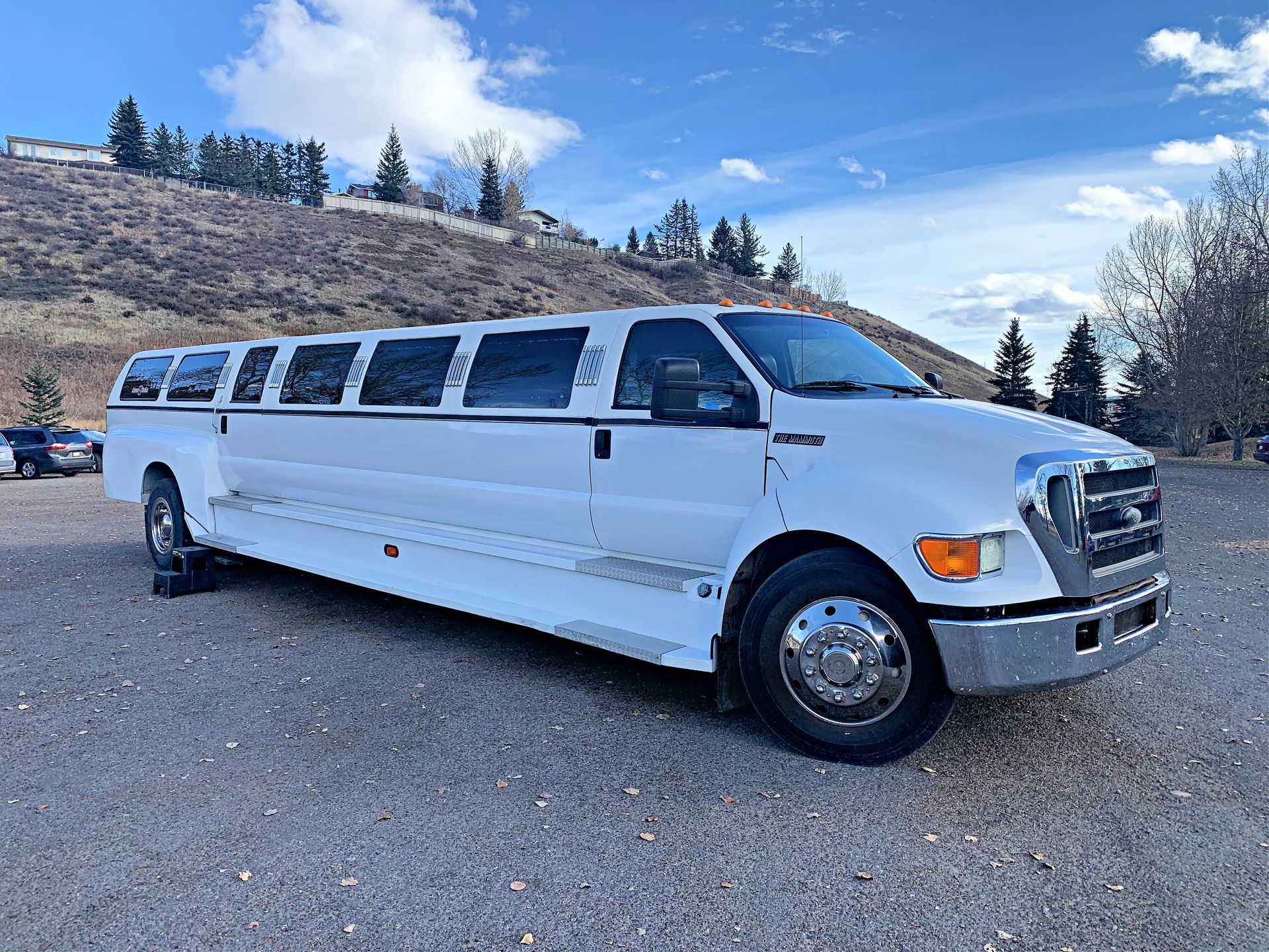 white stretch truck limousine exterior angled view