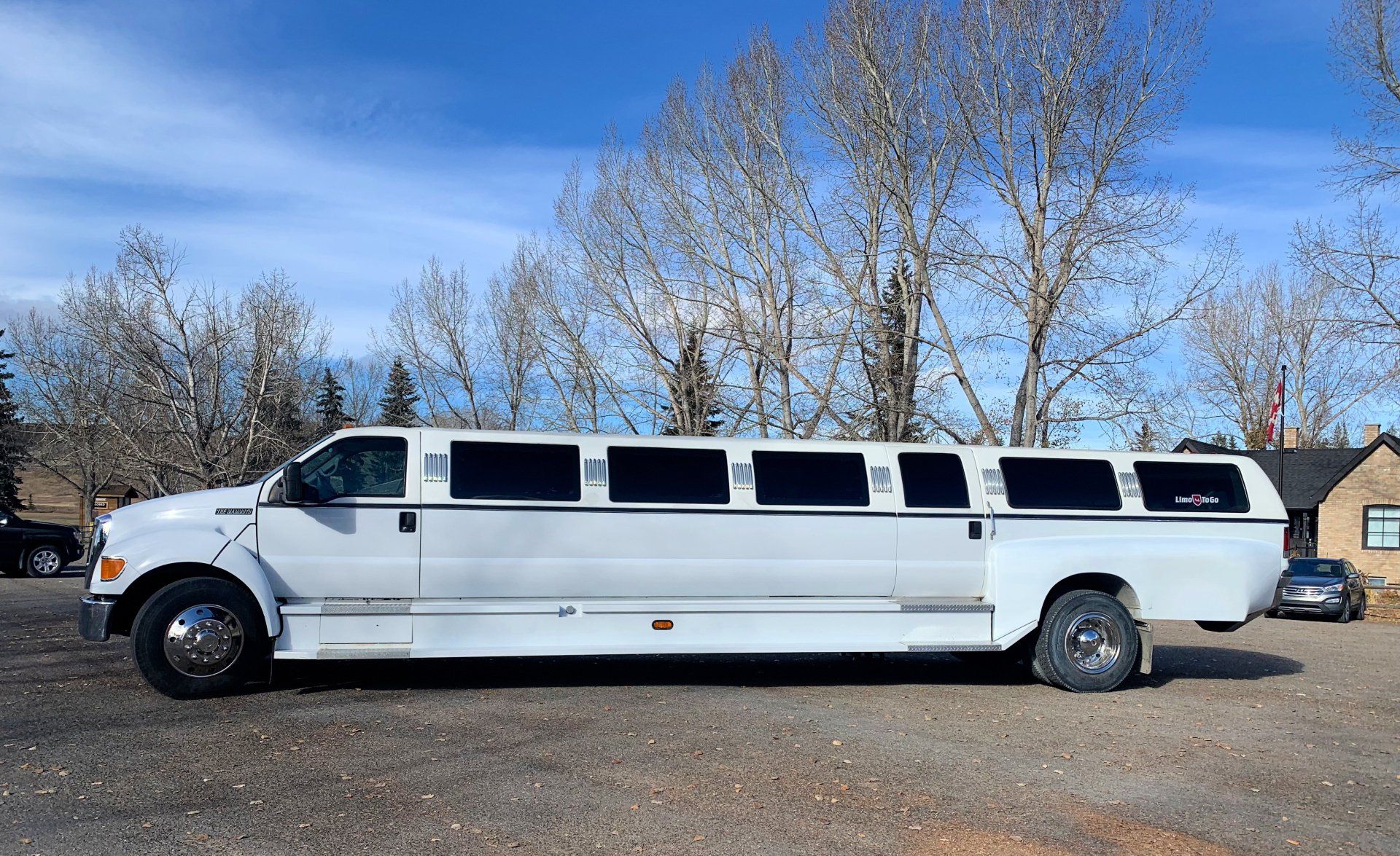 white Limo To Go F650 stretch truck limousine