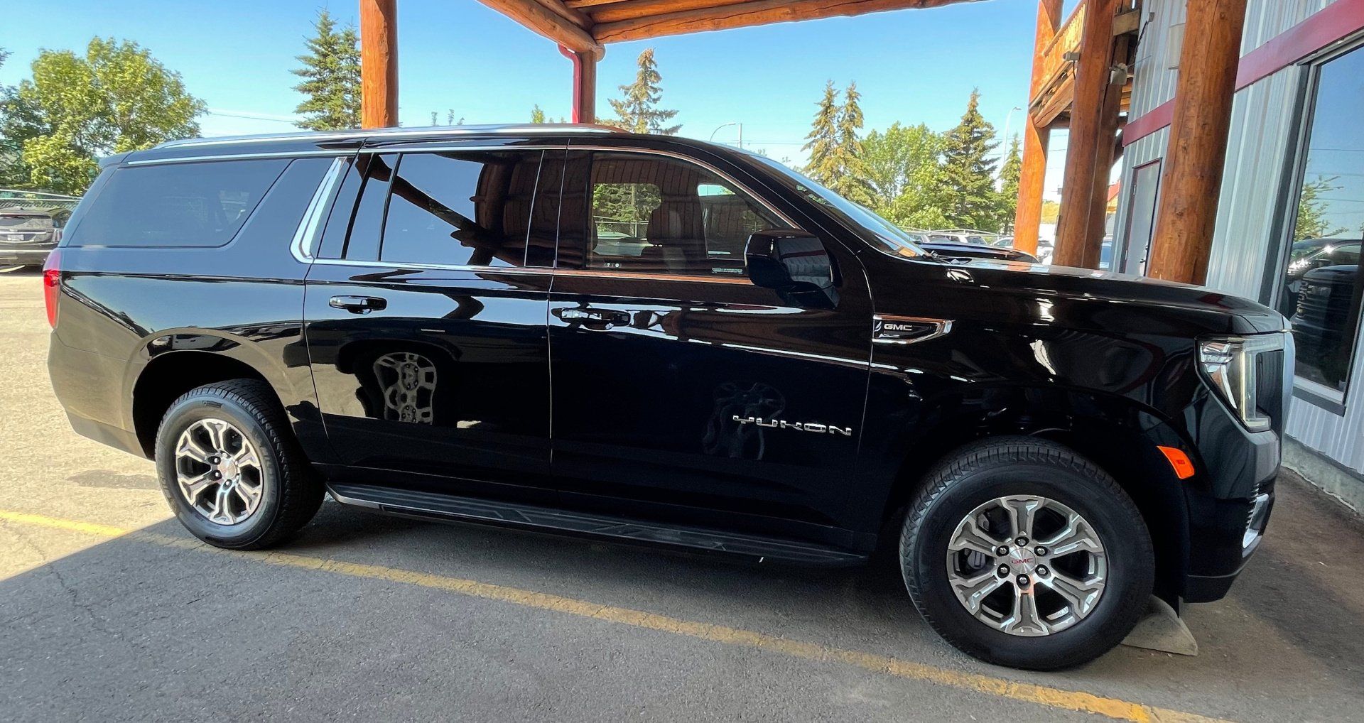 black Limo To Go GMC Yukon luxury SUV exterior