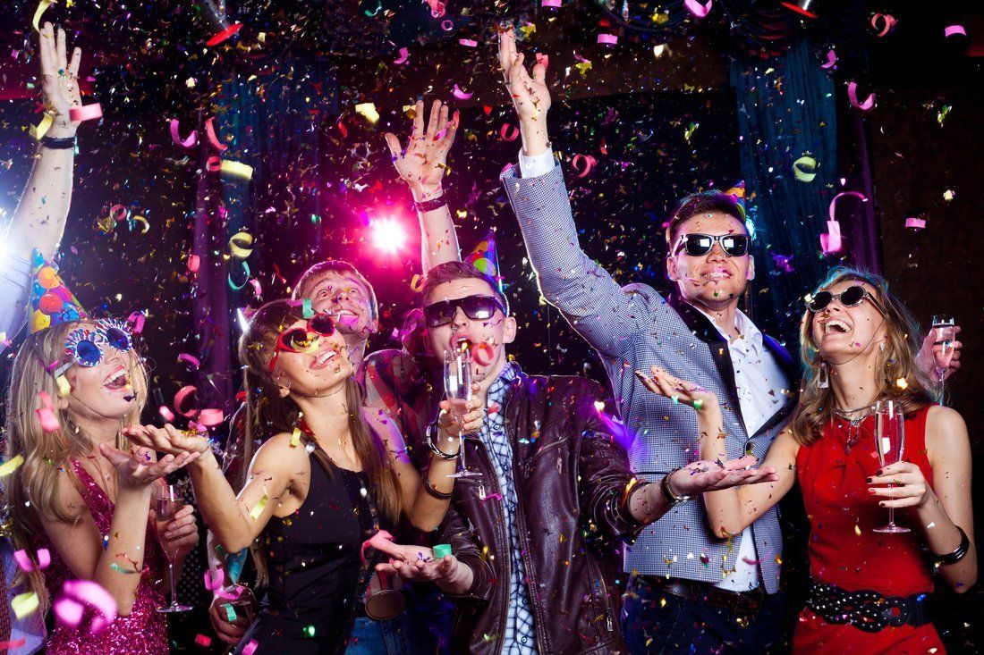 people having a party with confetti falling