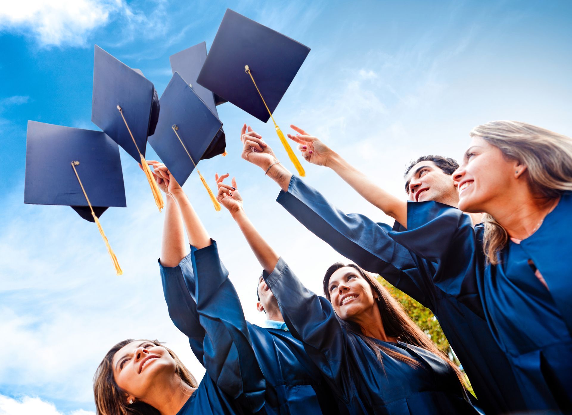graduation students with gowns and caps