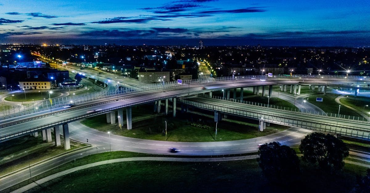An aerial view of a highway intersection at night.