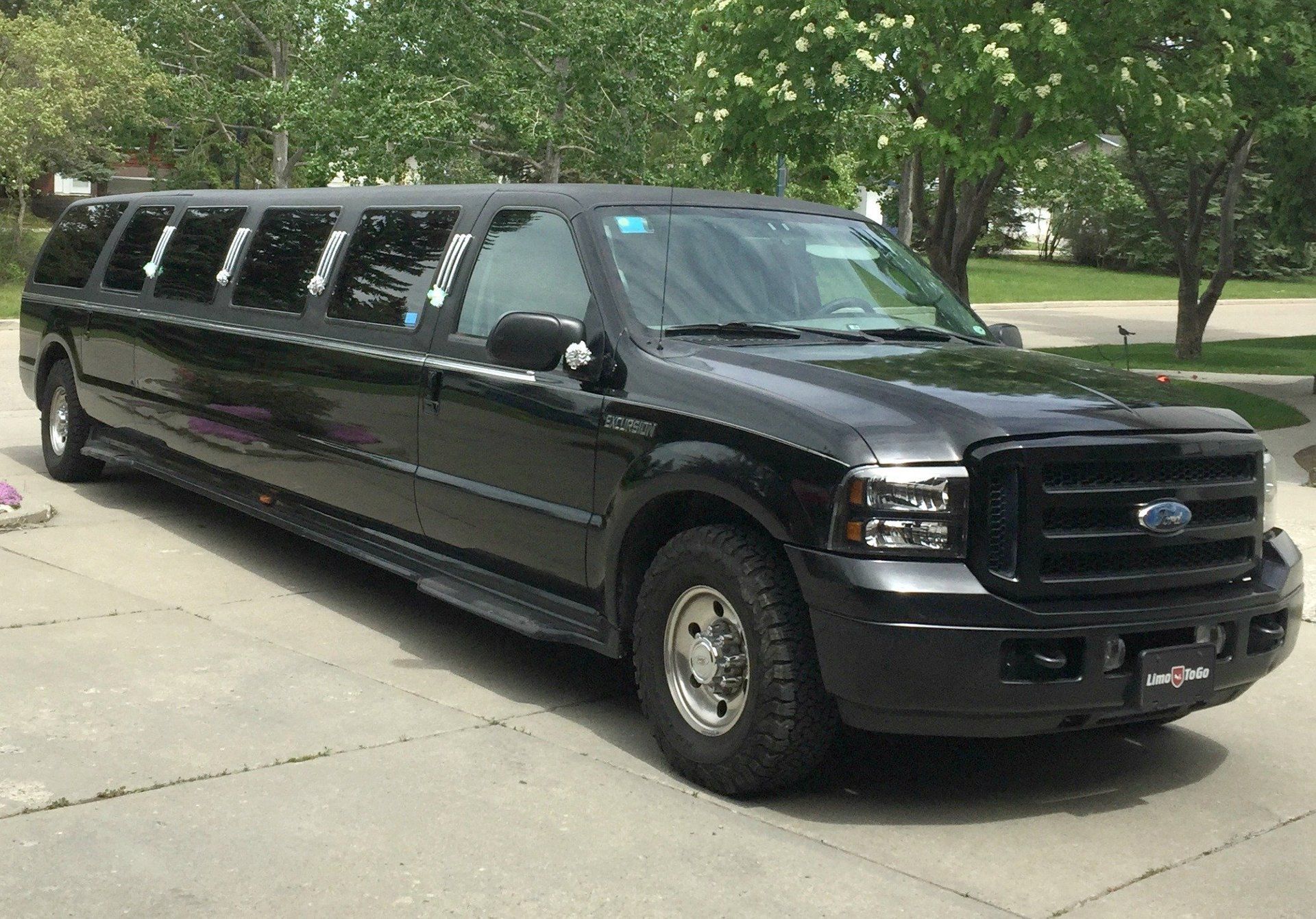 black Excursion 14 passenger SUV limousine