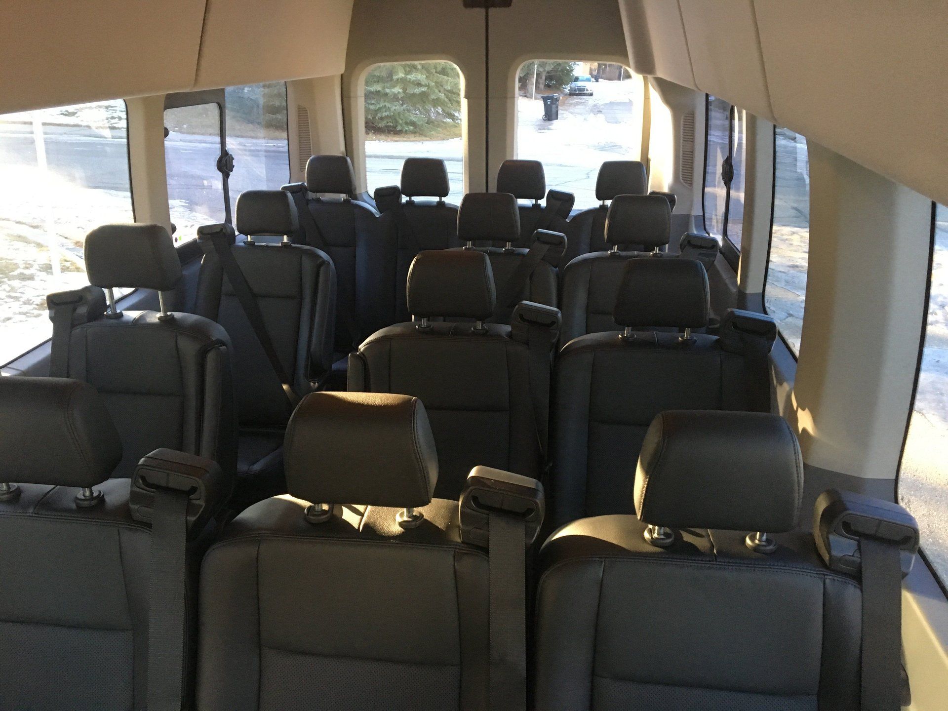 black 14 passenger executive shuttle bus interior leather seating
