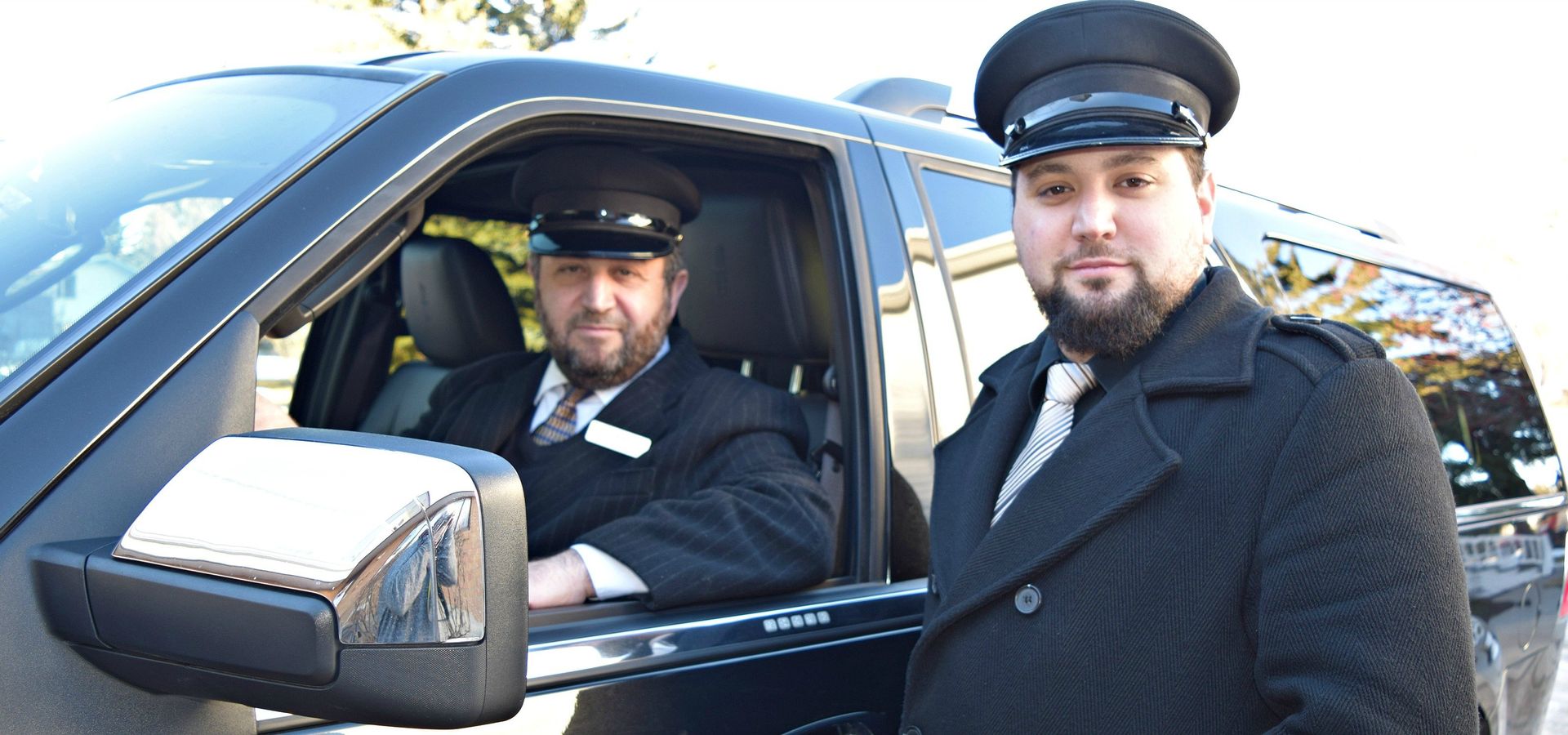 Professional chauffeurs with hats