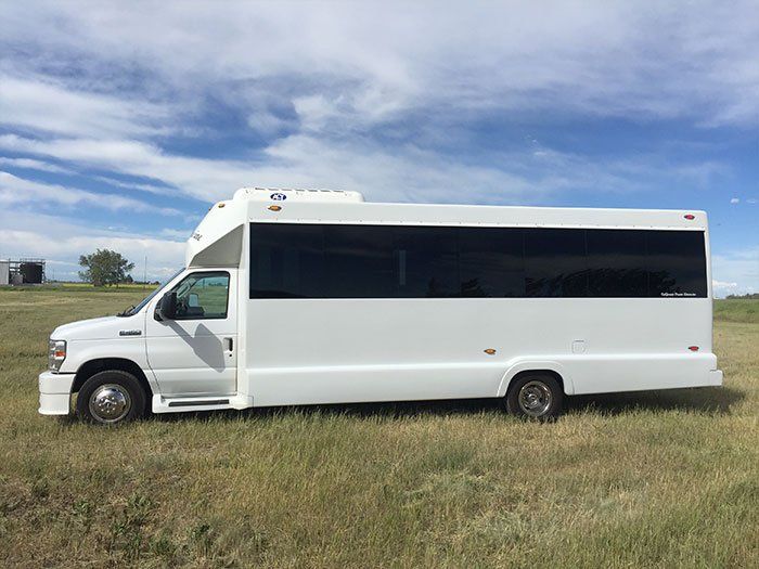 white Limo To Go 20 passenger party limo bus exterior