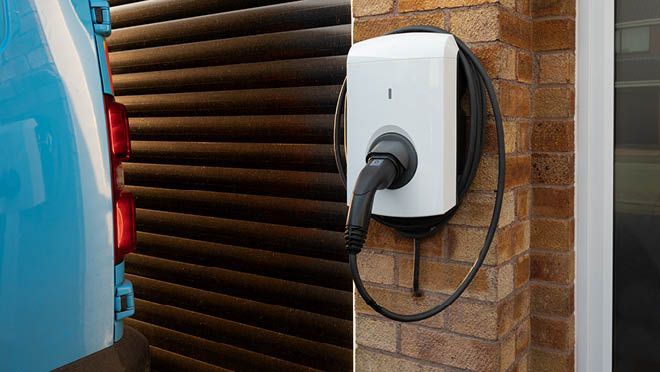 A close up of a electrical outlet on a wall.