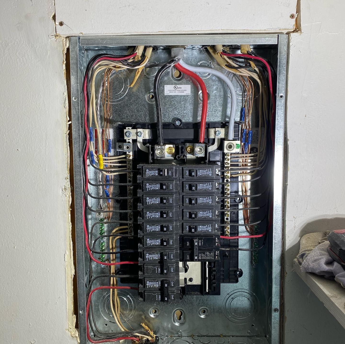 A electrical box with a lot of wires coming out of it
