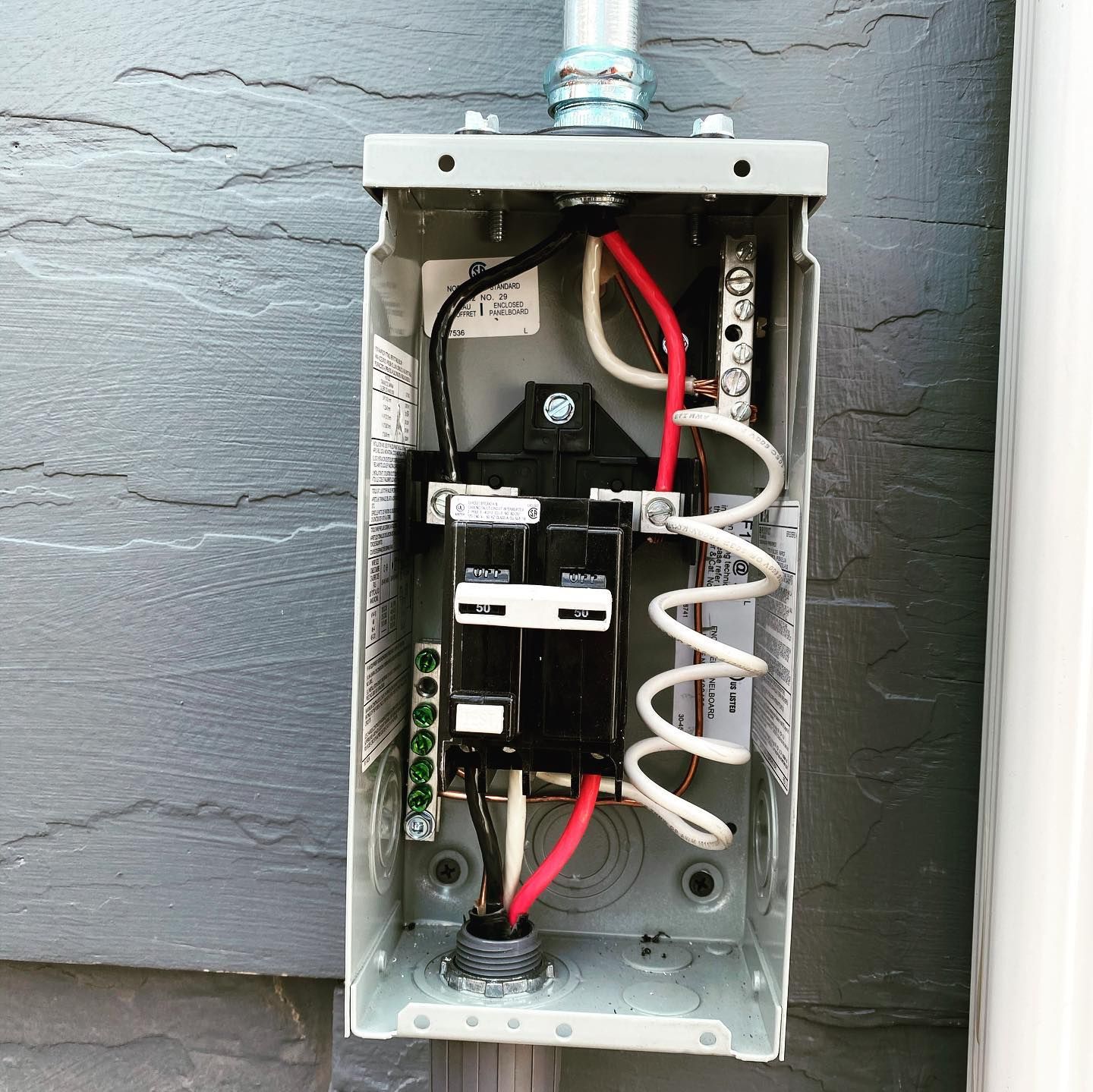 An electrical box with wires coming out of it