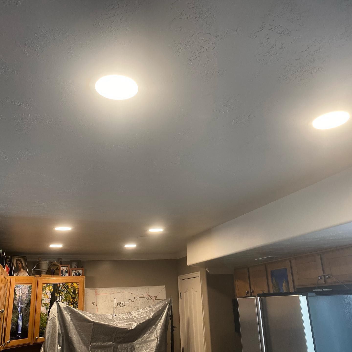 A kitchen with a ceiling that has a light on it.