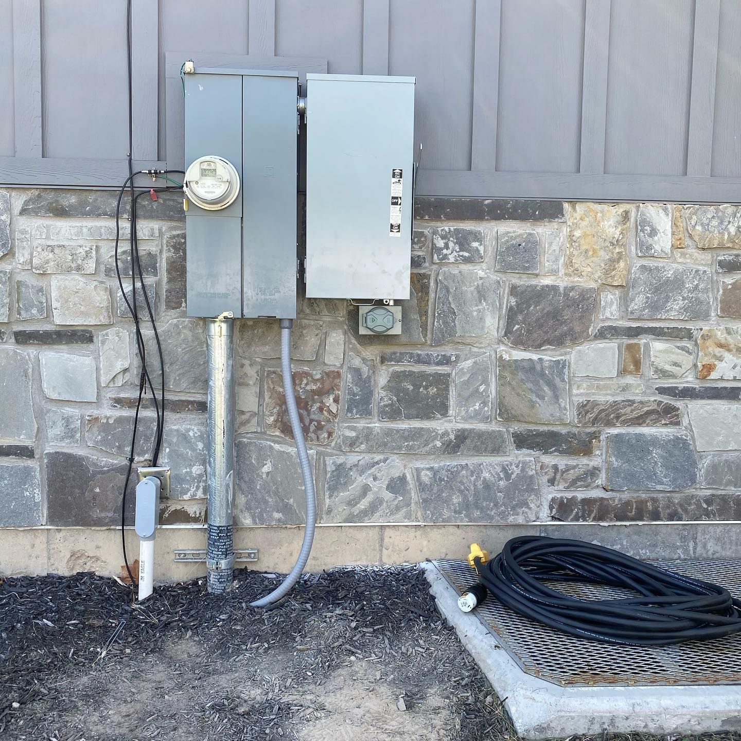 An electrical box on the side of a brick building