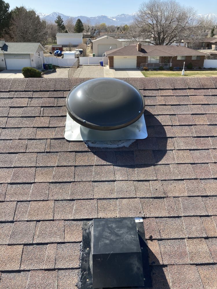 A roof with a fan on top of it