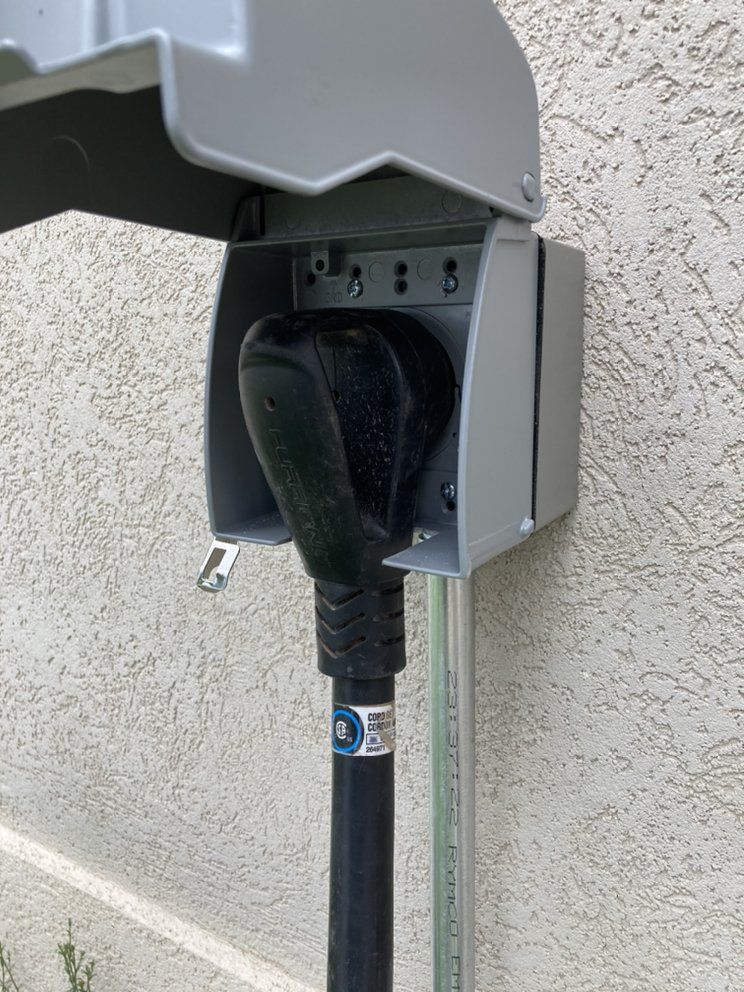 A close up of a electrical outlet on a wall.