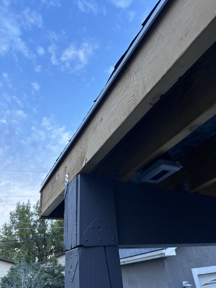 The roof of a building with a blue sky in the background