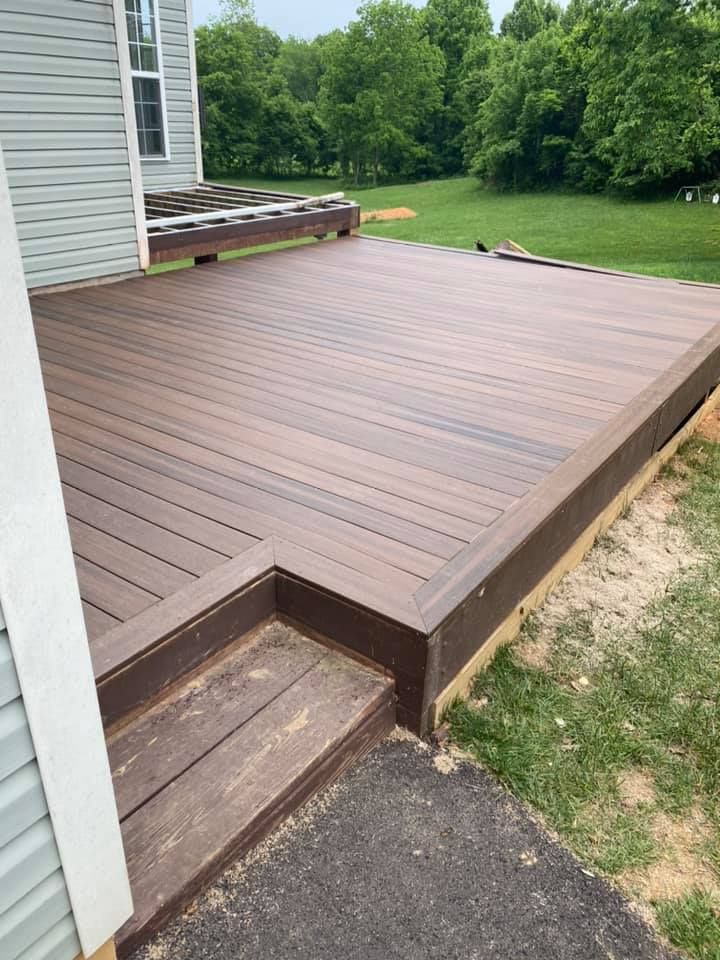 Newly installed deck with beautiful dark stained wood