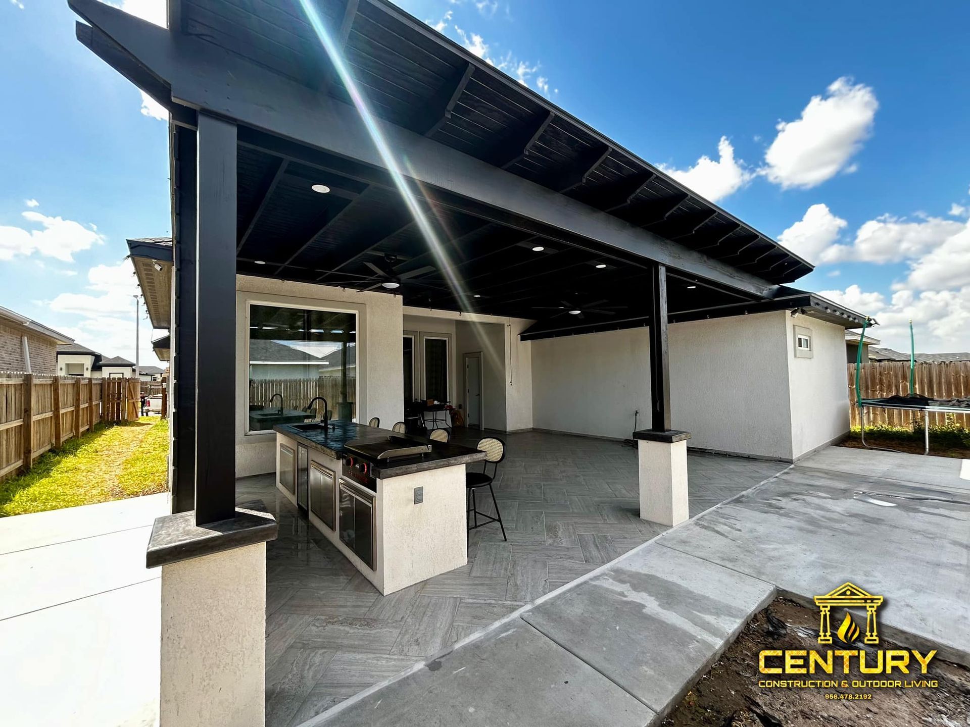 A century logo is on the side of a house