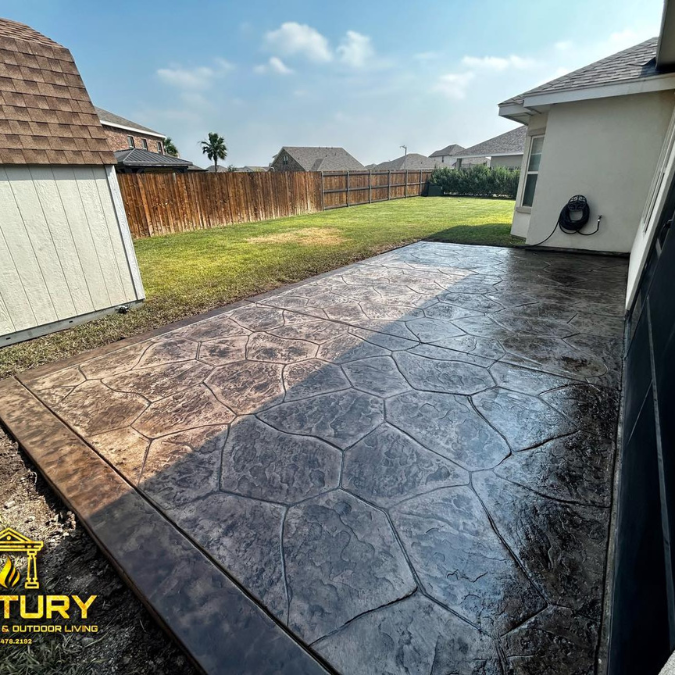 A concrete walkway in front of a house with a century logo on it