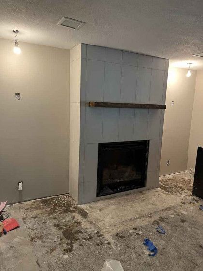 There is a fireplace in the middle of the room.