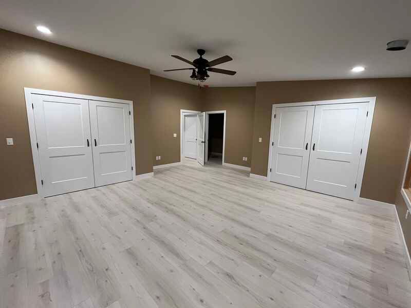 There is a ceiling fan in the middle of the room.