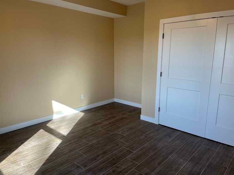 There is a closet in the corner of the room.