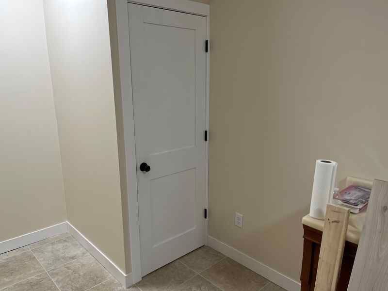 There is a door in the corner of the room.