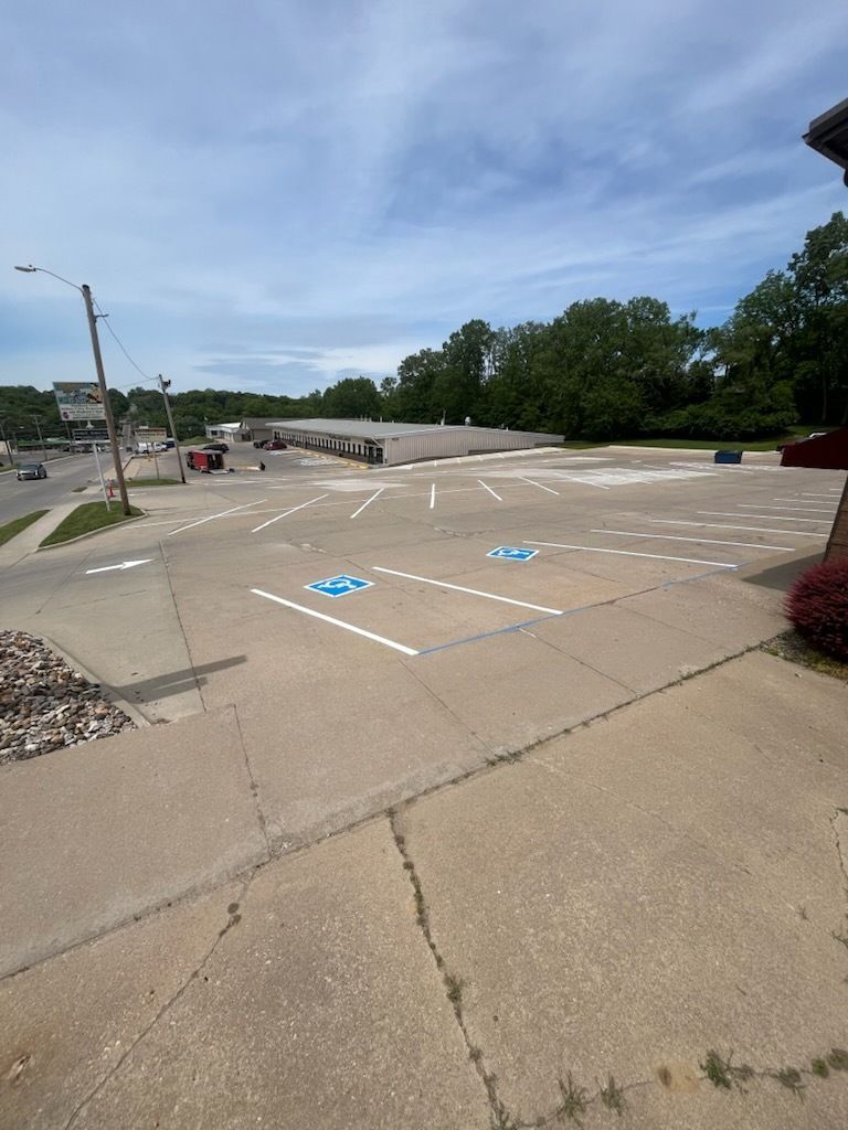 A parking lot with handicapped parking spots painted on it.