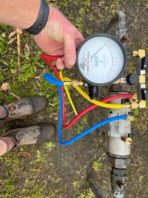 Man Checking Pressure Gauge