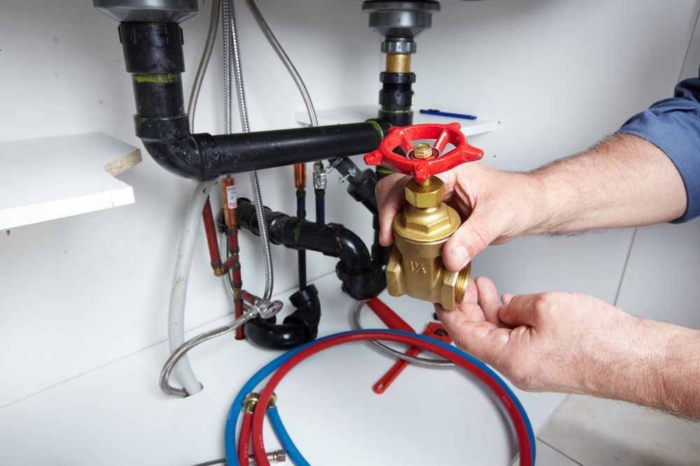 Plumber Installing Gate Valve