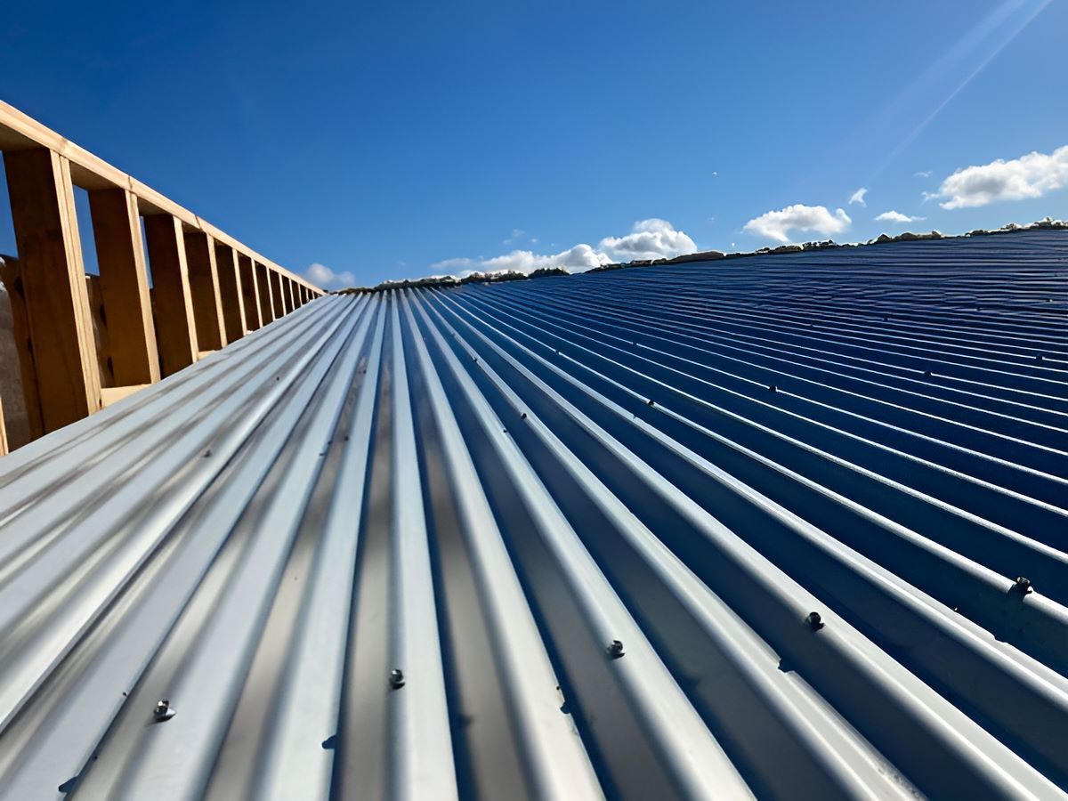A Metal Roof With A Blue Sky — iFix Roofing Geelong In South Geelong, VIC