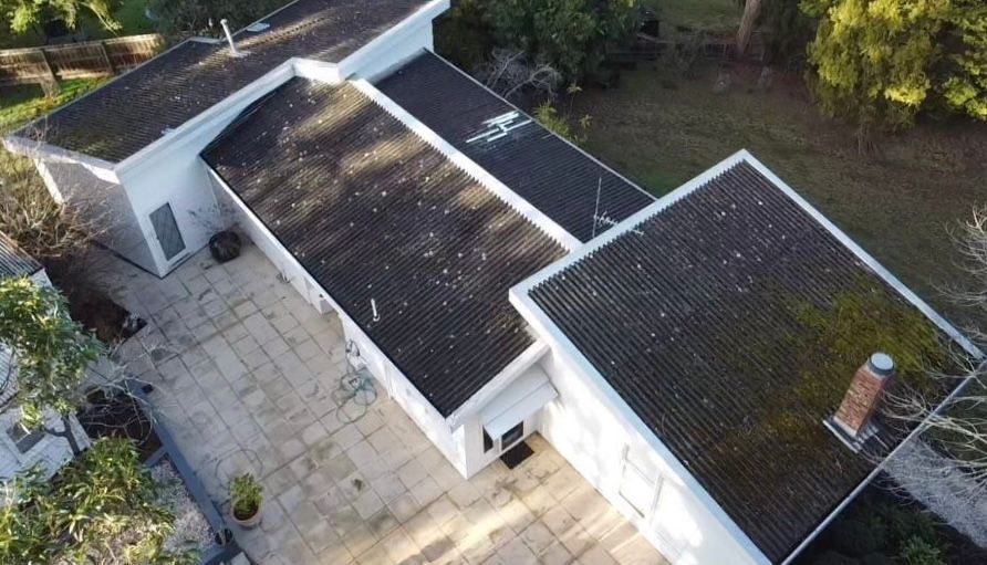 Aerial View Of A White House With Dark Shingled Roofs — iFix Roofing Geelong In South Geelong, VIC