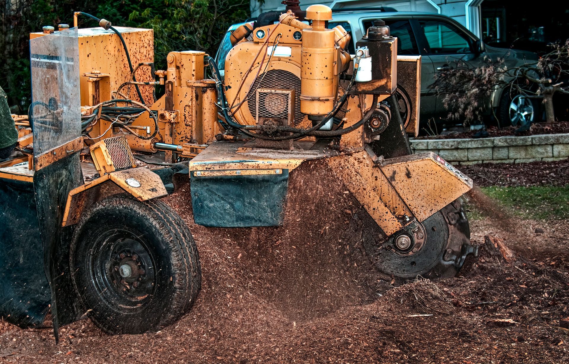 A stump grinder is being used to remove a tree stump.