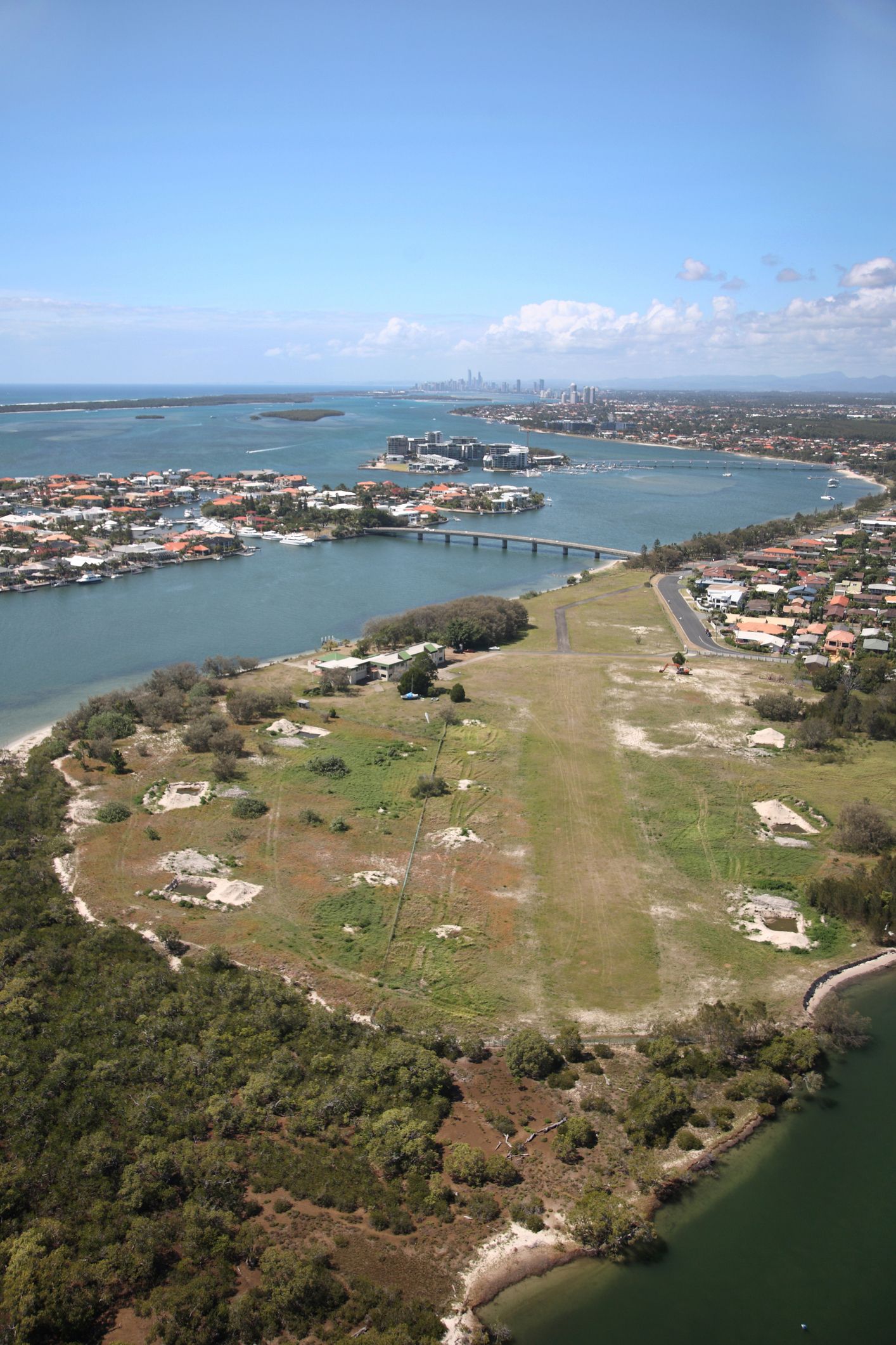 An aerial view of a small island in the middle of a body of water.