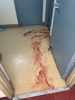 An before shot of a bloody floor from a crime scene cleanup in Ohio by Kingdom Bio Recovery & Restoration