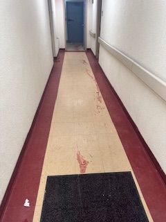 An before shot of a bloody floor from a crime scene cleanup in Ohio by Kingdom Bio Recovery & Restoration