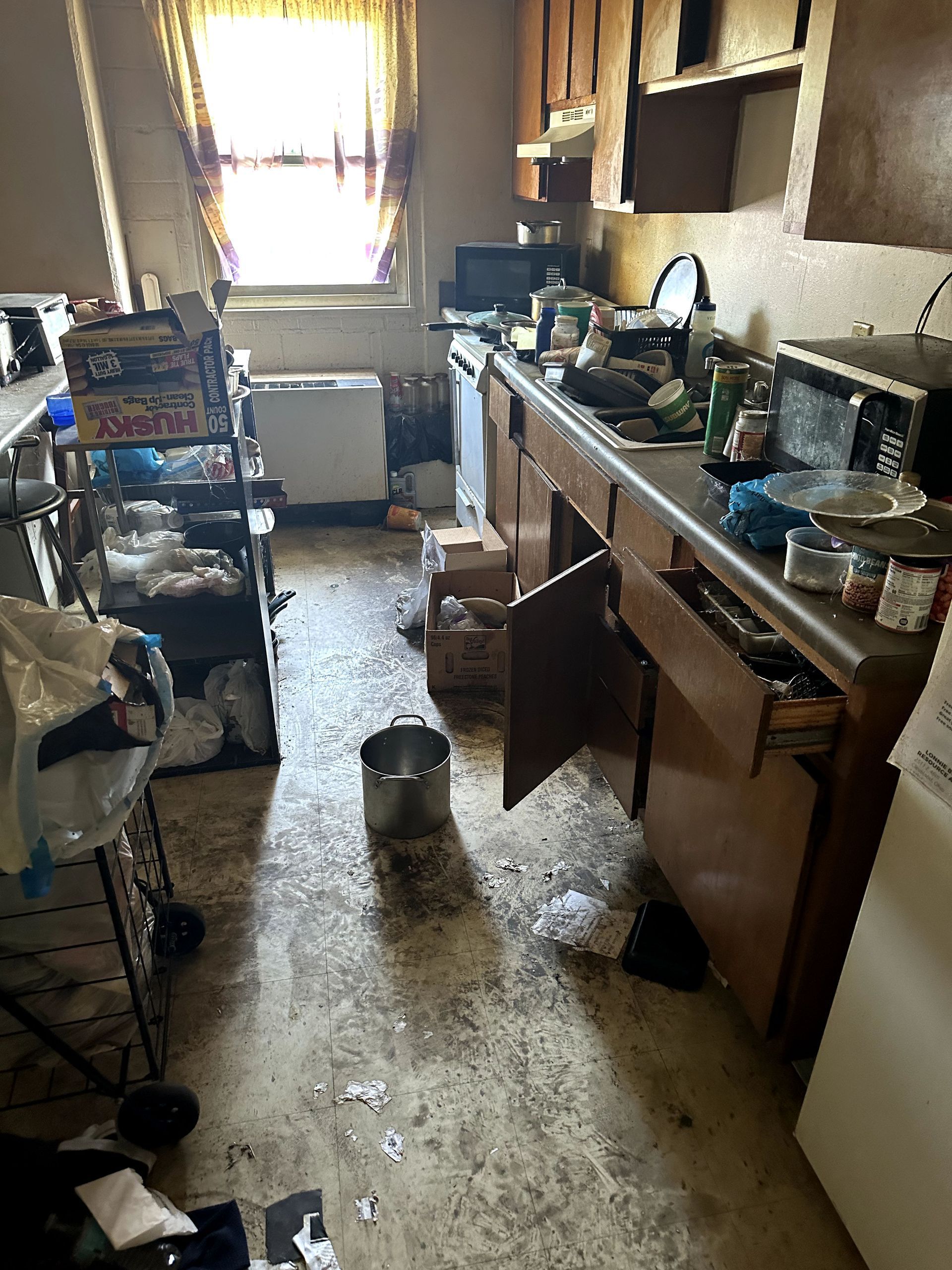 A before shot of a kitchen in a hoard cleanup in Ohio by Kingdom Bio Recovery & Restoration