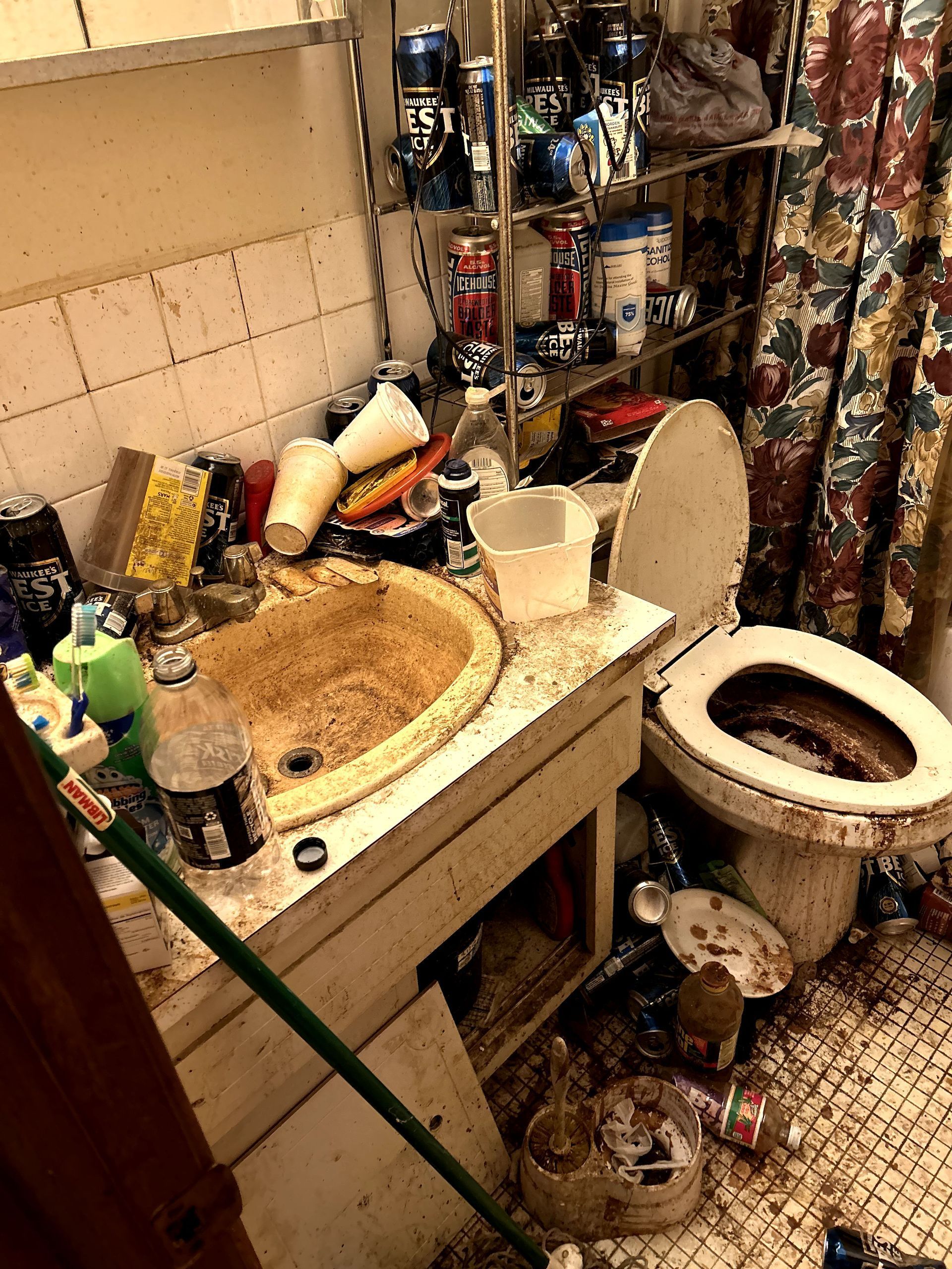 A before shot of a bathroom in a hoard cleanup in Pittsburgh, PA by Kingdom Bio Recovery & Restoration
