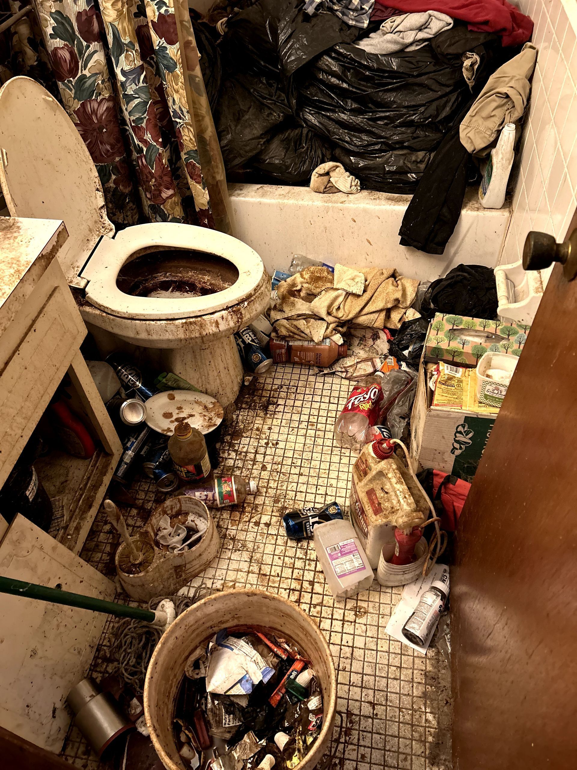 A before shot of a bathroom in a hoard cleanup in Pittsburgh, PA by Kingdom Bio Recovery & Restoration