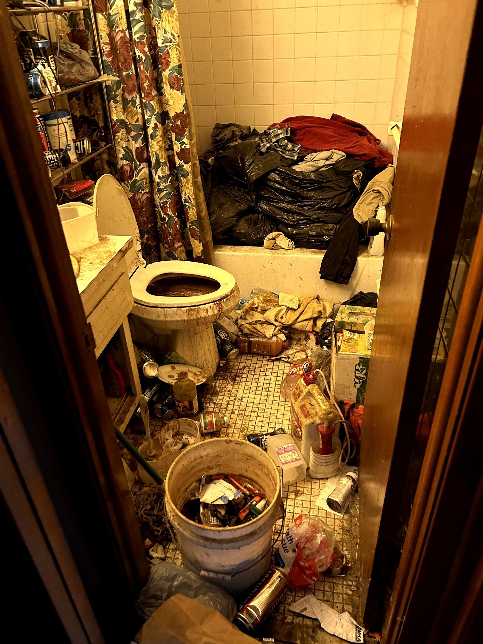 A before shot of a bathroom in a hoard cleanup in Pittsburgh, PA by Kingdom Bio Recovery & Restoration