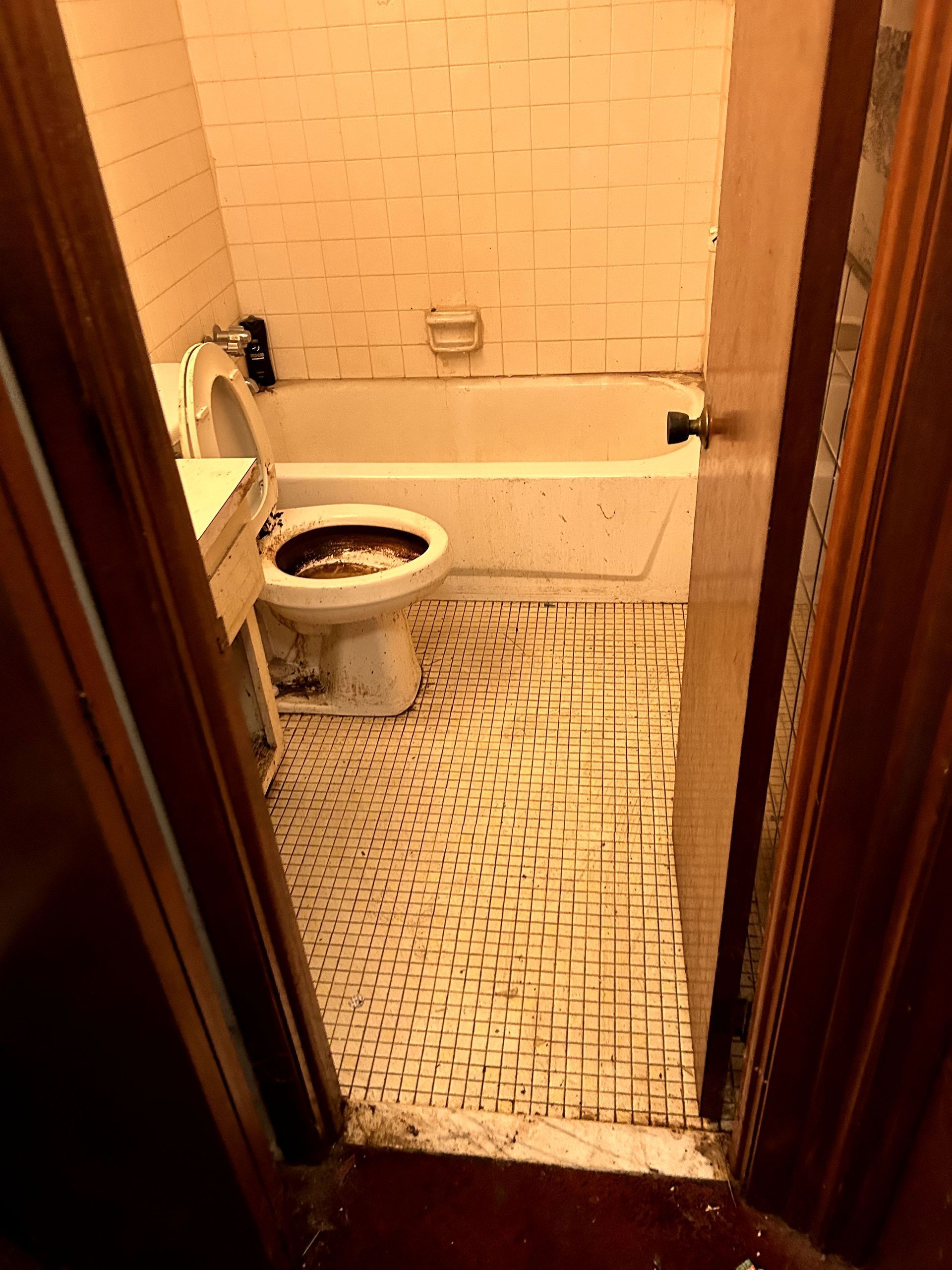 A during shot of a bathroom in a hoard cleanup in Pittsburgh, PA by Kingdom Bio Recovery & Restoration hard at work