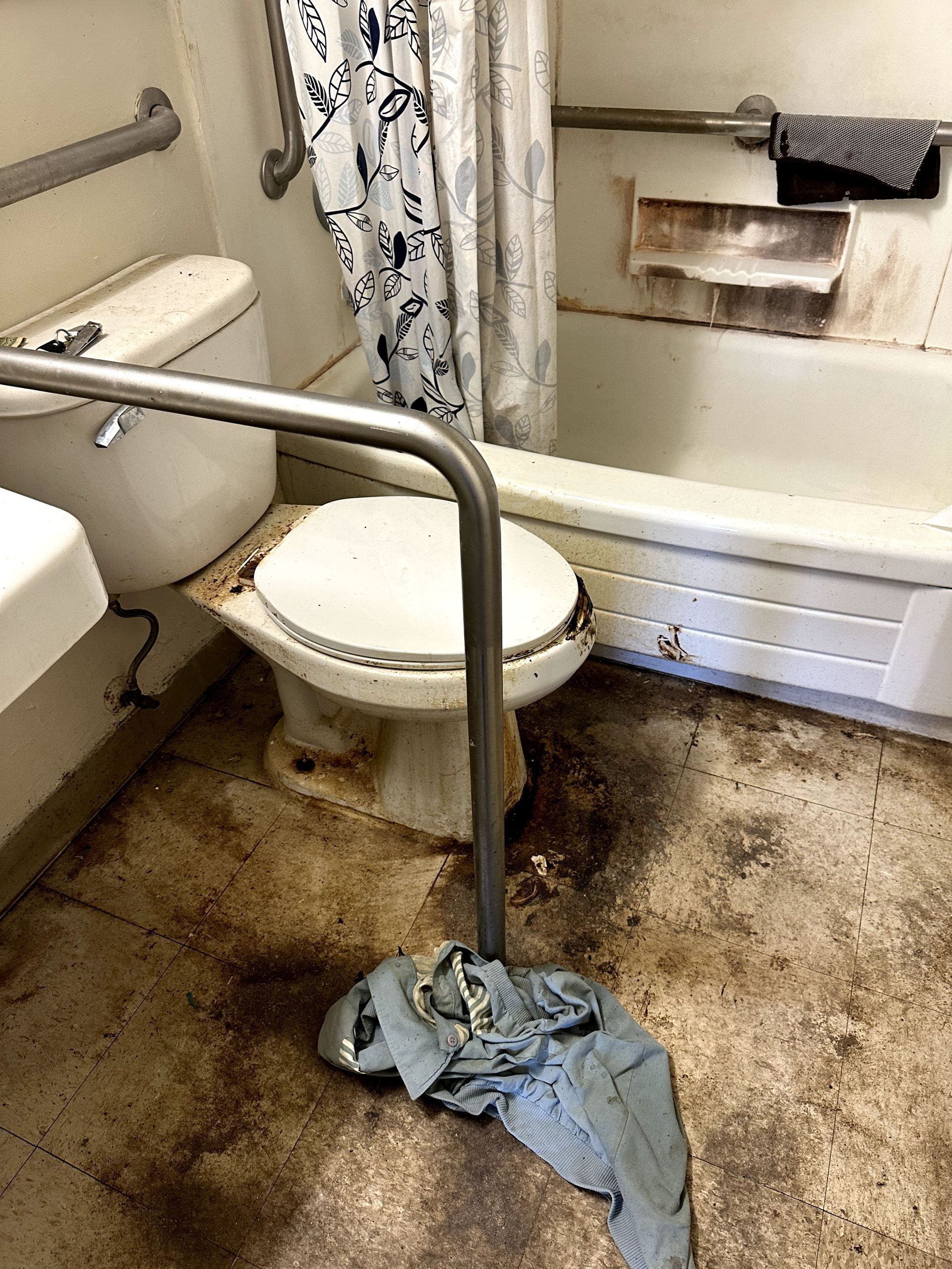 A before shot of a bathroom in a hoard cleanup in Pittsburgh, PA by Kingdom Bio Recovery & Restoration