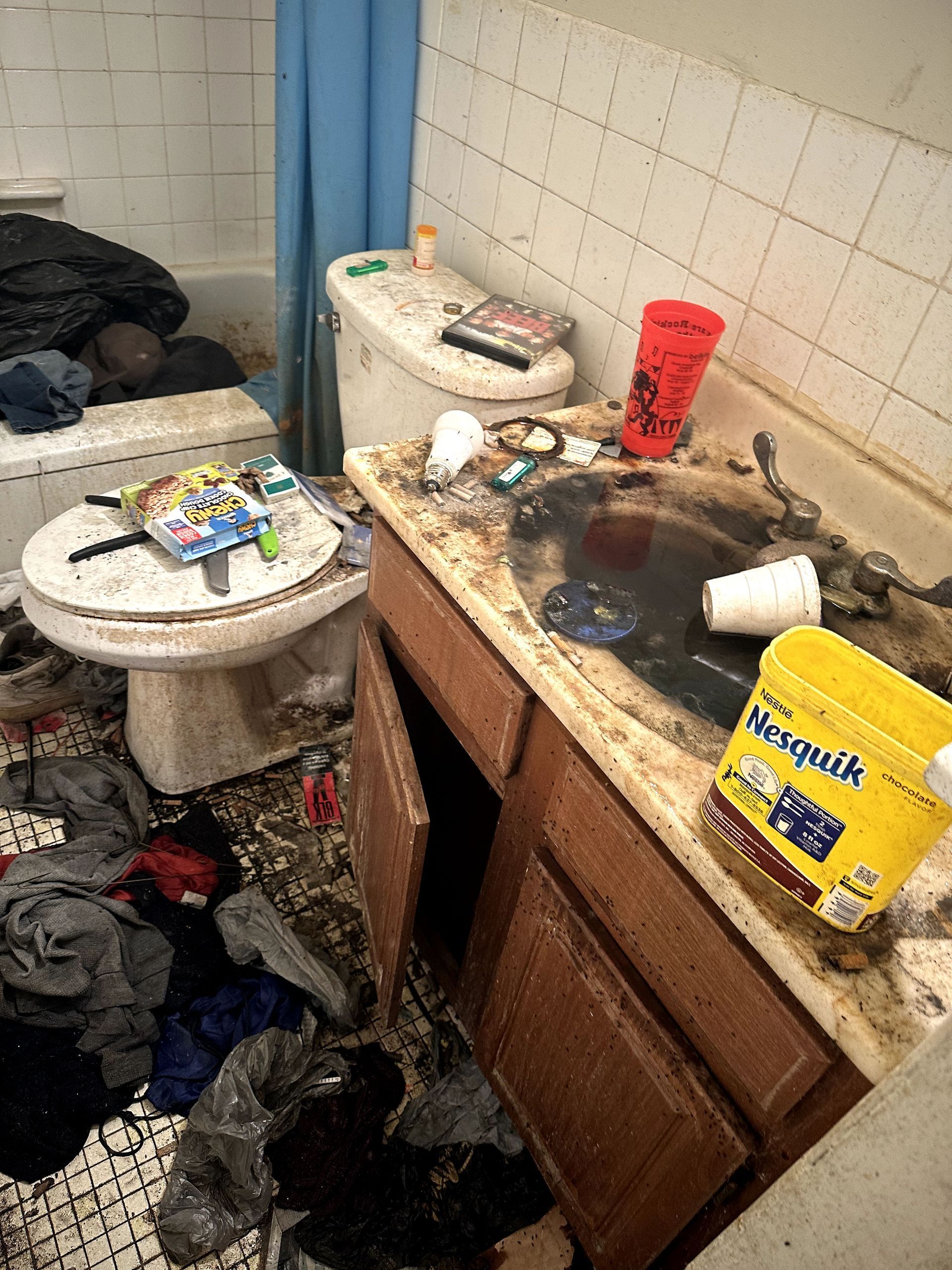 A before shot of a bathroom in a hoard cleanup in Pittsburgh, PA by Kingdom Bio Recovery & Restoration