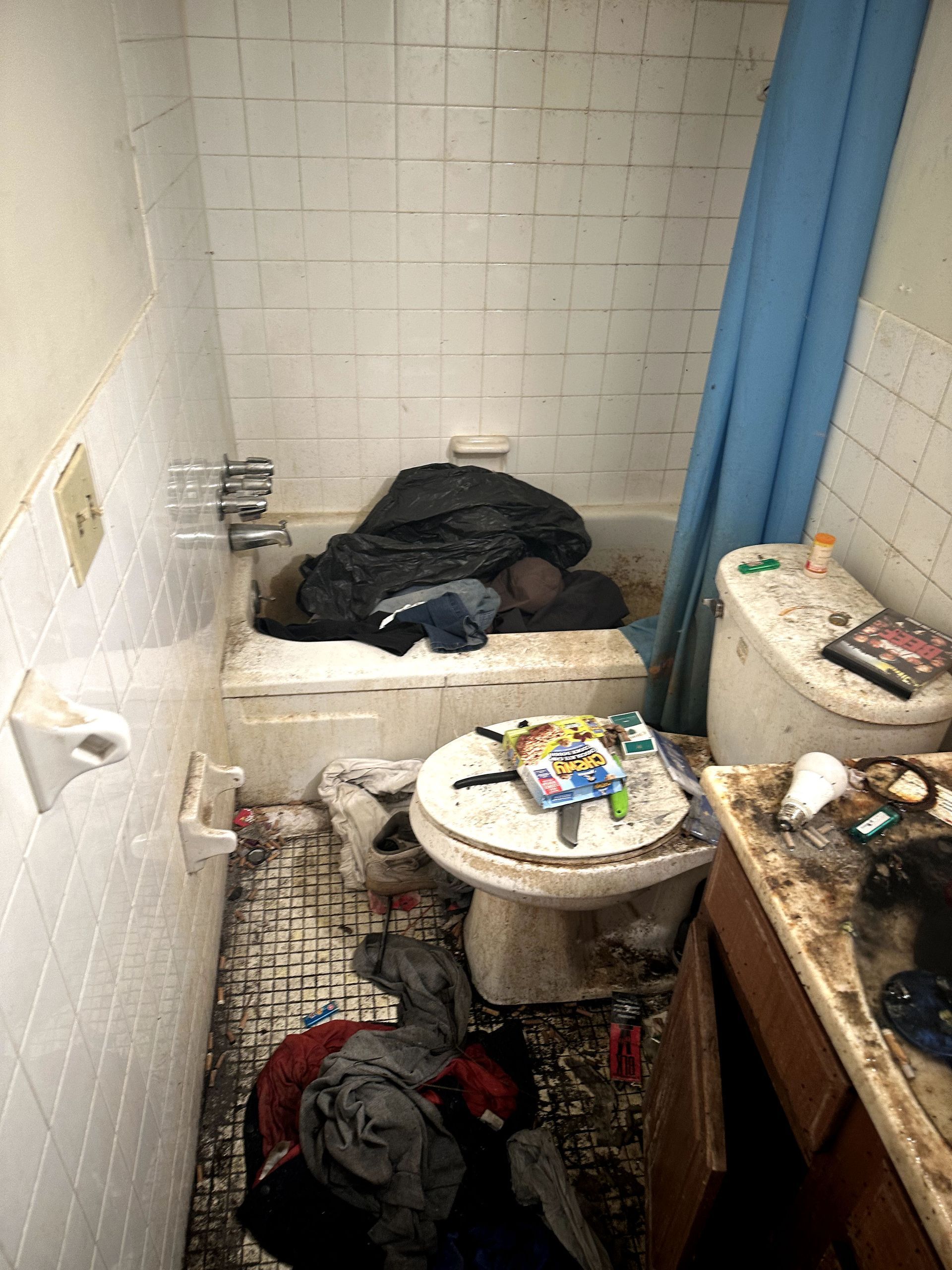 A before shot of a bathroom in a hoard cleanup in Pittsburgh, PA by Kingdom Bio Recovery & Restoration