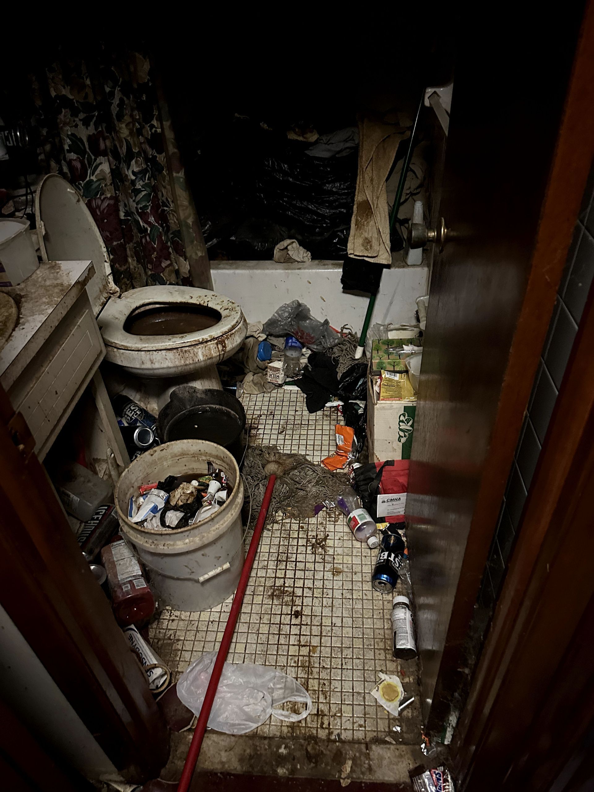 A before shot of a bathroom in a hoard cleanup in Pittsburgh, PA by Kingdom Bio Recovery & Restoration