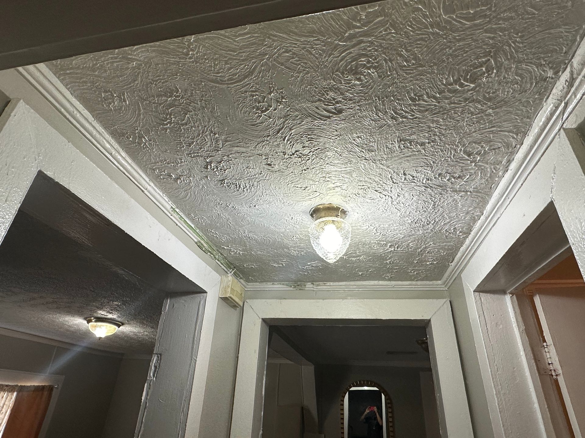 A hallway with a light on the ceiling