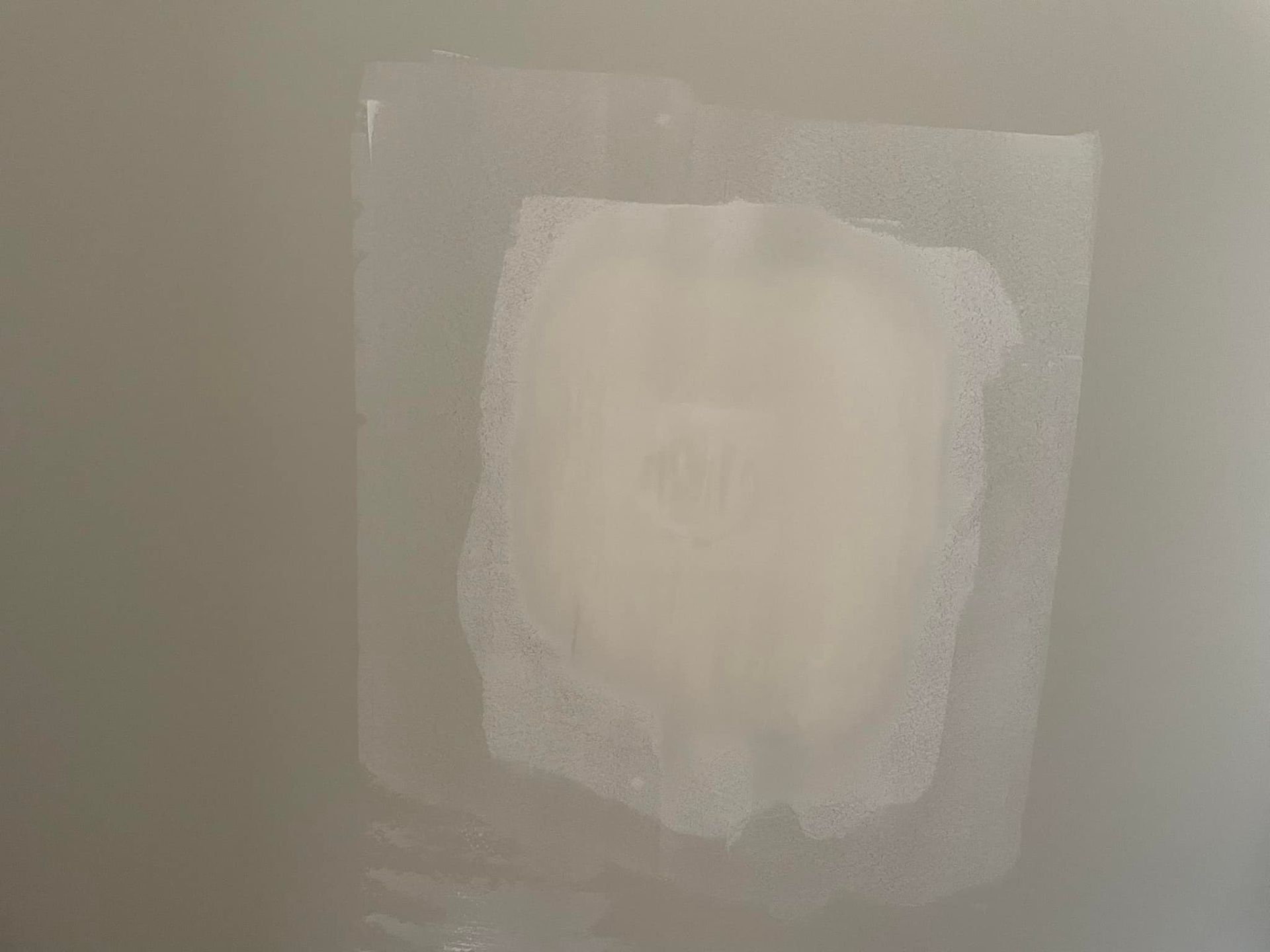 A piece of soap is sitting on a white surface.