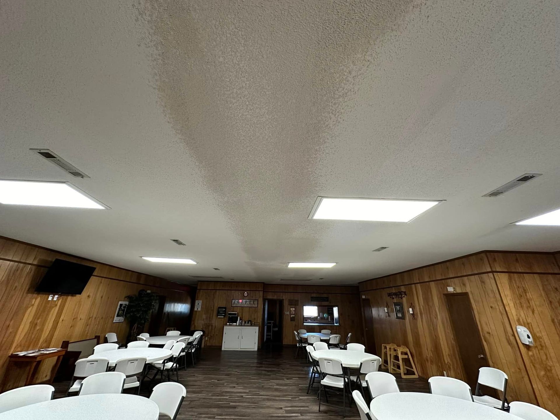 A large room with tables and chairs in it